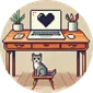 A desk with a laptop displaying a pixelated heart. A cat sits on a stool in front of the desk.